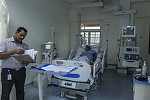 One of the hospital staff reviewing the medical charts of a patient in the ICU. Believers-Church-Medical-College-Hospital-staff.jpg