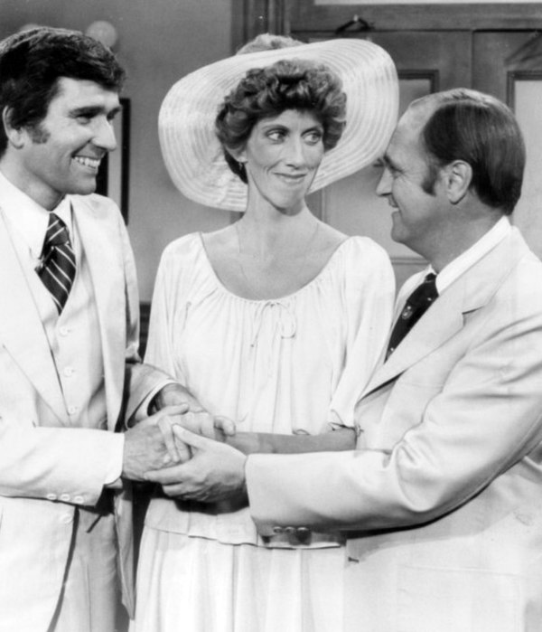 Bob (right) congratulates Carol and Larry Bondurant on their marriage.
