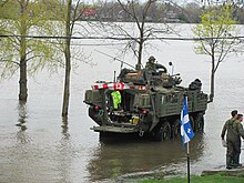 Canadian soldiers from operation LENTUS deployed on a flooded street in Laval, Quebec. CDNSoldiersLavalFlood.jpg