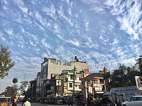 Daily life of Kashipur with patterned clouds.jpg