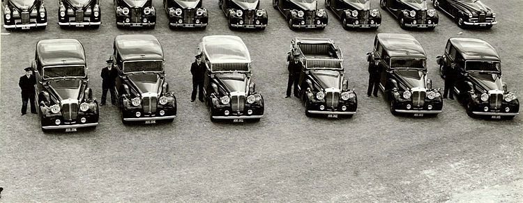 Cars bought for George VI's planned tour of New Zealand 1952
limousine, landaulette and allweather with perspex head
and their three backup cars Daimler Straight-Eight Wgtn.jpg