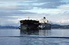 The Exxon Valdez a few hours after she ran aground. Exxon Valdez Oil Spill (13266806523).jpg