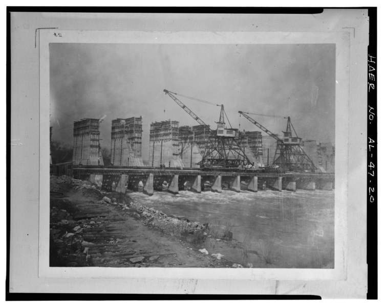File:GENERAL VIEW OF CONSTRUCTION LOOKING NORTHEAST SHOWING THE CONSTRUCTION BRIDGE, GANTRY CRANE AND STRUCTURAL PIERS. - Wilson Dam and Hydroelectric Plant, Spanning Tennessee River HAER ALA,17-MUSHO,2-20.tif
