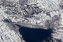 The western end of Lake Ontario. The region takes its name from the horseshoe shape. Golden Horseshoe snowily wrapping the end of Lake Ontario.jpeg