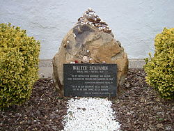 Walter Benjamin's grave in Portbou. The epitaph in German, repeated in Catalan, quotes from Section 7 of "Theses on the Philosophy of History": "There is no document of culture which is not at the same time a document of barbarism" Grab Walter Benjamin.jpg