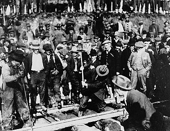 Laying the last spike of the Grand Trunk Pacific Railway in Fort Fraser, British Columbia GrandTrunkLastSpike.jpg