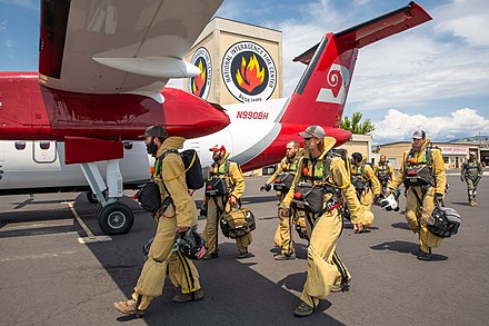 Bureau of Land Management smokejumpers prepare for a training jump at the National Interagency Fire Center.