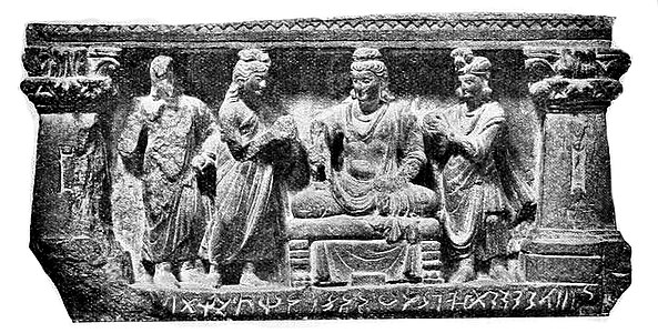 Pedestal of the Hashtnagar Buddha statue, now in the British Museum, inscribed with "year 384" (probably of the Yavana era), hence 209 CE.[10] The inscription reads in the Kharoshthi script: sam 1 1 1 100 20 20 20 20 4 Prothavadasa masasa divasammi pamcami 4 1 ("In the year 384, on the fifth, 5, day of the month Prausthapada").[15] The pedestal was sawed off from the body of the statue by L. White King in 1883 and brought to the British Museum.[16] British Museum