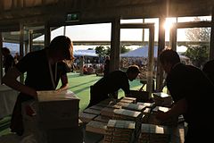 Workers prep books for signing at the bookstore