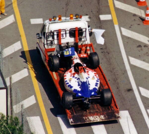 Inoue's damaged car is towed back to the pits after his bizarre practice accident at the 1995 Monaco Grand Prix.