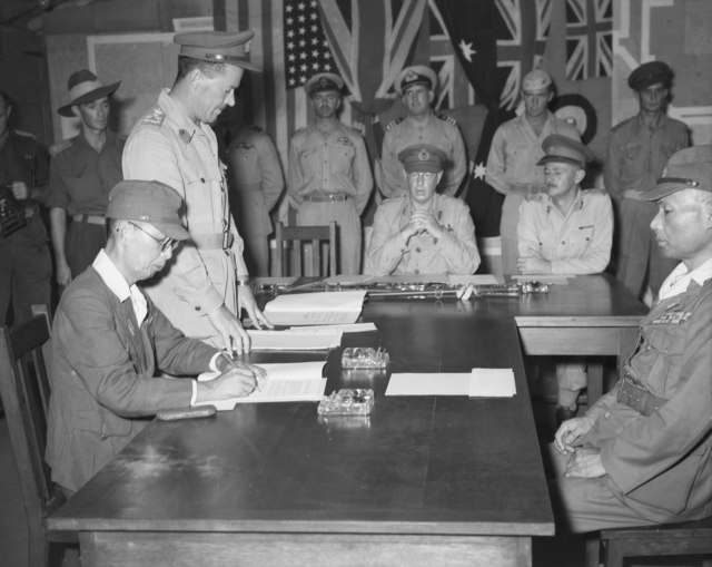 Brigadier Garrett with Lieutenant General Kanda at the Japanese surrender on Bougainville, 8 September 1945. Vice Admiral Samejima sits opposite, and 