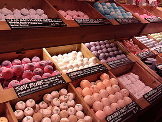 A bath bomb is a consumer product used during bathing. It was invented and patented in 1989 by Mo Constantine, co-founder of Lush Cosmetics. It is a compacted mixture of wet and dry ingredients molded into any of several shapes and then dried. Bath water effervesces at the surface of a bath bomb immersed within it, with attendant dispersion of such ingredients as essential oil, moisturizer, scent, or colorant.