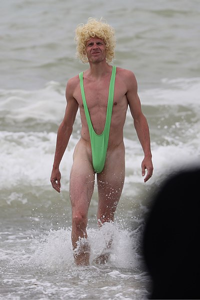 File:Mankini Borat style on the beach - man looking natural wearing green swimsuit.jpg