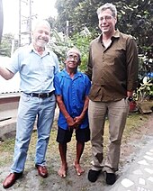 Moore (right) with fellow hostage Rolly Tambara at a reunion in Seychelles in 2018 Michael Scott Moore with fellow hostage.jpg