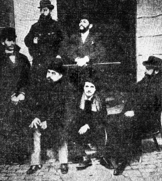 Adevărul editors in 1897. Constantin Mille is first seated from left. Standing behind him are Ioan Bacalbașa (middle) and Constantin Bacalbașa (right)