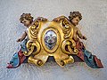 * Nomination Woodcarved, polichromed gilded putti with coat of arms. --Moroder 12:07, 23 February 2021 (UTC) * Promotion  Support Good quality. It's your coat of arms? :) --Tournasol7 12:18, 23 February 2021 (UTC)