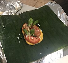 Nacatamal with both banana leaf and aluminum foil wrapping