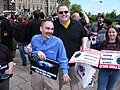 National Capital FreeNet DSL technicians Daniel Brousseau (left, blue shirt) and Anna (right) at the Net Neutrality Rally, Ottawa ON 27 May 2009