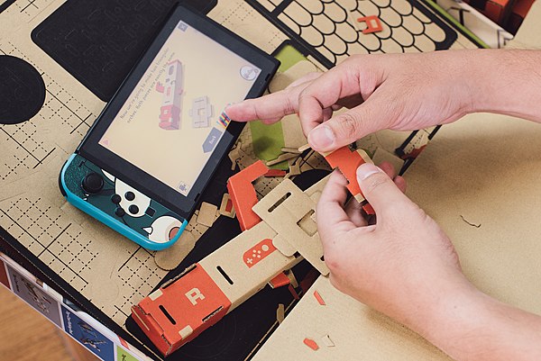 A Toy-Con being constructed from punch-outs from cardboard sheets with instructions via the Switch Labo software