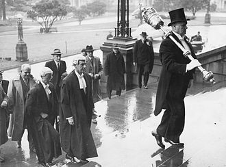 Opening of 29th NZ Parliament in 1950, with Serjeant-at-Arms, Group Captain Alexander Manson carrying the mace, followed by Speaker Matthew Oram Opening of 29th NZ Parliament.jpg
