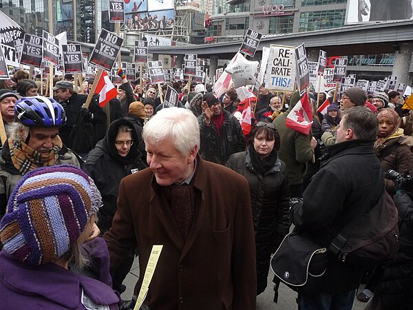 Rae attending a protest in Toronto Centre