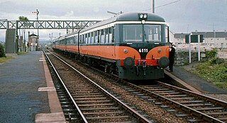 Driving trailer 6111, the former railcar 2624 and the only surviving example of the 2600 class, heads a push–pull train at Howth Junction on May 11, 1974