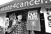 Rob Dyer in front of a booth for Skate4Cancer Rob Dyer in front of a Skate 4 Cancer booth.jpg