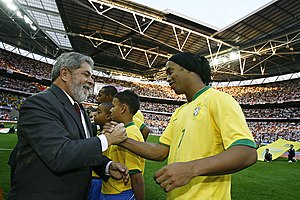 Former president Luiz Inacio Lula da Silva and Ronaldinho greet each other before a match. Ronaldinho and Lula.jpg