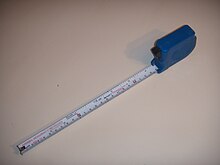 https://upload.wikimedia.org/wikipedia/commons/thumb/a/af/Tape_measure_No_1.jpg/220px-Tape_measure_No_1.jpg