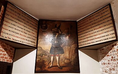 The Trusty Servant and accompanying Latin and English texts, on the wall beside the kitchen, Winchester College, first painted in 1579 by John Hoskins. The current painting is by William Cave, 1809. Trusty Servant and texts.jpg