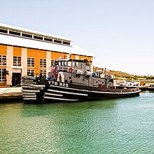 Wanamassa, moored at Pier Tango, Guantanamo, on 1 April 2015, when she was one of the last five tugs of her class to remain in service USS Wanamassa (YTB 820) in Guantanamo Bay, 2014 04 01 -a.jpg