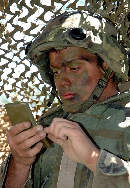 File:US Navy 050421-N-1722M-044 Builder Seaman Josh Frederickson, assigned to Naval Mobile Construction Battalion Three (NMCB-3) based at Port Hueneme, Calif., applies camoflauge paint during the Bearing Duel exercise.jpg