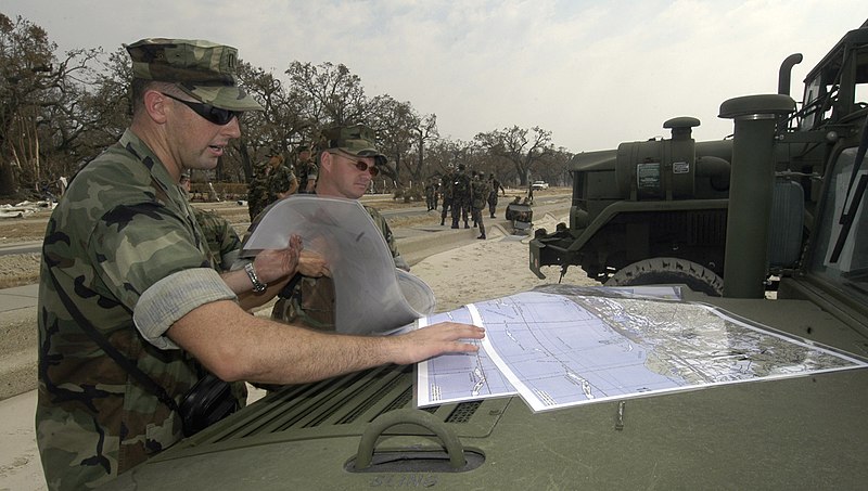 File:US Navy 050904-N-6204K-029 U.S. Navy Seabees plan their routes as they prepare to conduct clean-up efforts on the beach in Biloxi, Miss.jpg