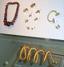 Bronze Age gold dress-fasteners and torc, amber necklace, Ulster Museum UlsterMuseumPrehistoryBrGold (2).JPG