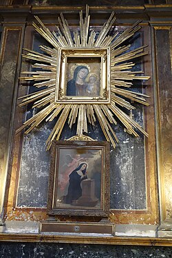 Vergine delle Grazie. Därunder en bild föreställande den heliga Rita av Cascia.