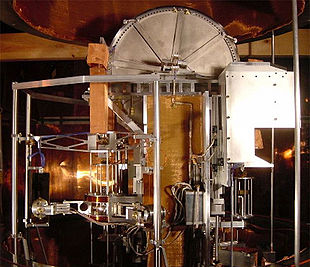 The NIST's Kibble balance is a project of the US government to develop an "electronic kilogram". The vacuum chamber dome, which lowers over the entire apparatus, is visible at top. Watt balance, large view.jpg