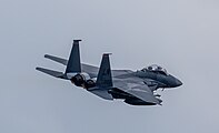 An F-15E Strike Eagle, tail number 01-2003, taking off from RAF Lakenheath in England. The aircraft is assigned to the 494th Fighter Squadron.