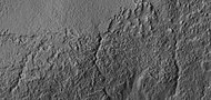 Close view of small channels that seem to originate in a mantle layer, as seen by HiRISE under HiWish program