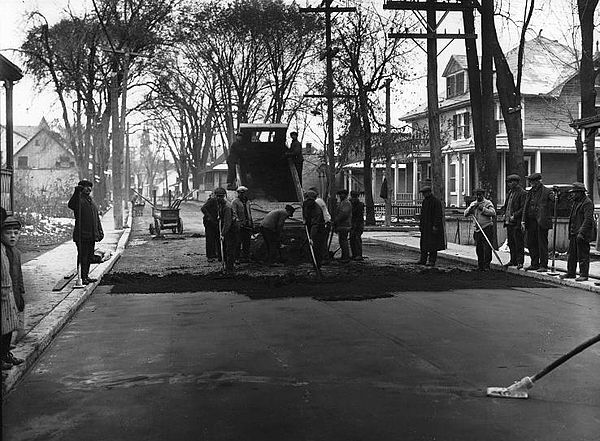 Workers spreading asphalt in Sault-au-Récollet about 1930.