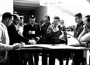 Wilhelms (second from left) briefing astronauts in 1964. Astronauts Visit McMath-Pierce Solar Telescope (AstronautBrief64-CC).jpg