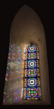 Stained glass window in the collegiate church of Bédouès, Lozère, France.