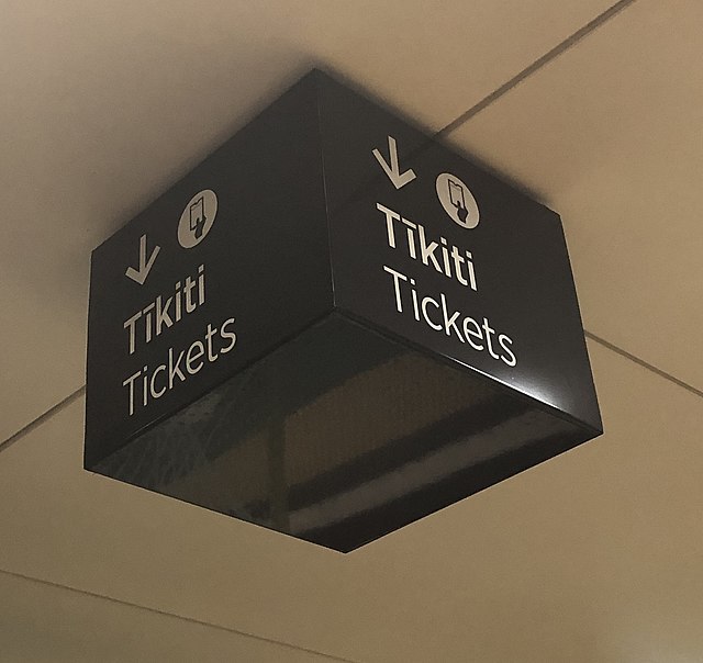 Bilingual sign at railway station in Auckland, New Zealand