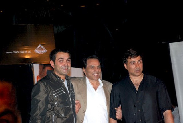Deol with his father Dharmendra and brother Sunny Deol in 2011