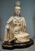 Chinese Yuan/Ming dynasty wood carving of Avalokitesvara (Guanyin) seated in a relaxing position