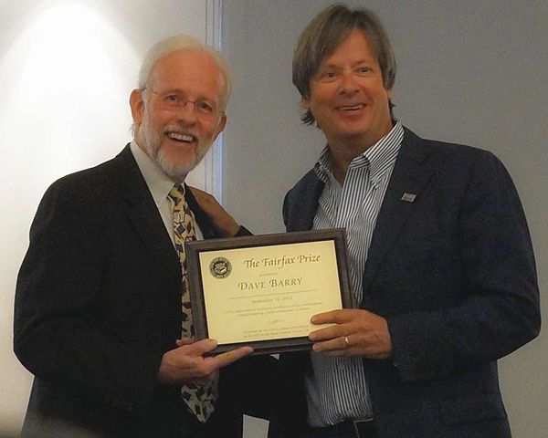 Brian Engler, Chair of the Fairfax Library Foundation, presents the 2013 Fairfax Prize to Dave Barry on September 22, 2013.