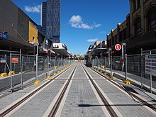 The Parramatta light rail line running through Church Street Church Street light rail stop under construction in April 2023.jpg