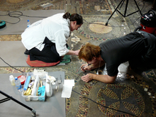 Conservators carrying out restoration work on the Cosmati pavement, 2009 Conservation work on the Cosmati pavement at Westminter Abbey, 2009..png