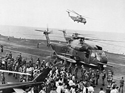 Evacuees from Saigon, South Vietnam are offloaded onto the U.S. Navy aircraft carrier USS Midway, during "Operation Frequent Wind", April 29, 1975. Evacuees offloaded onto the USS Midway.jpg