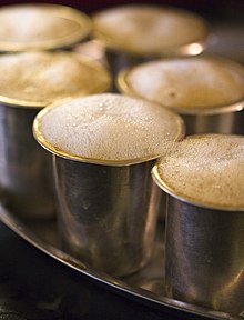 Indian filter coffee in metal tumblers in Mavalli Tiffin Room, Bengaluru Foaming filter coffee.jpg