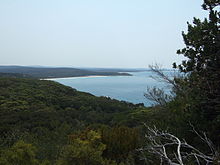 A view from partway up Rame Head, looking north along the beach towards Wingan Inlet